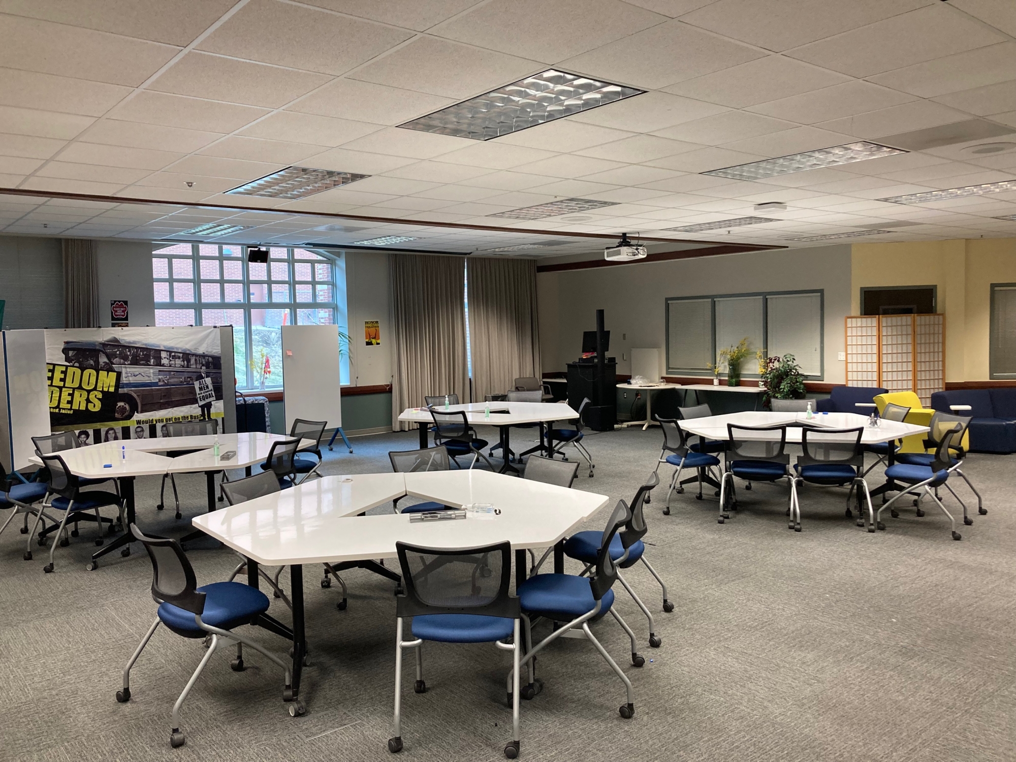 Meeting room layout hexagon tables and whiteboards