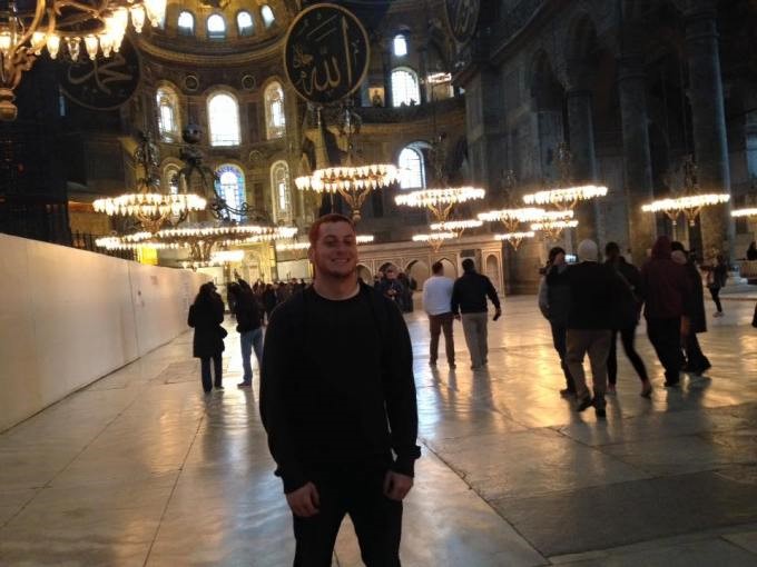 A student in Istanbul in front of a lot of lights