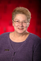 Image of Paulette Bond, the background is red.