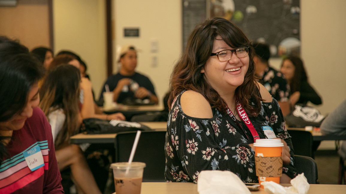 A student smiles from ear to ear within the college assistance migrant program at Central Washington University.