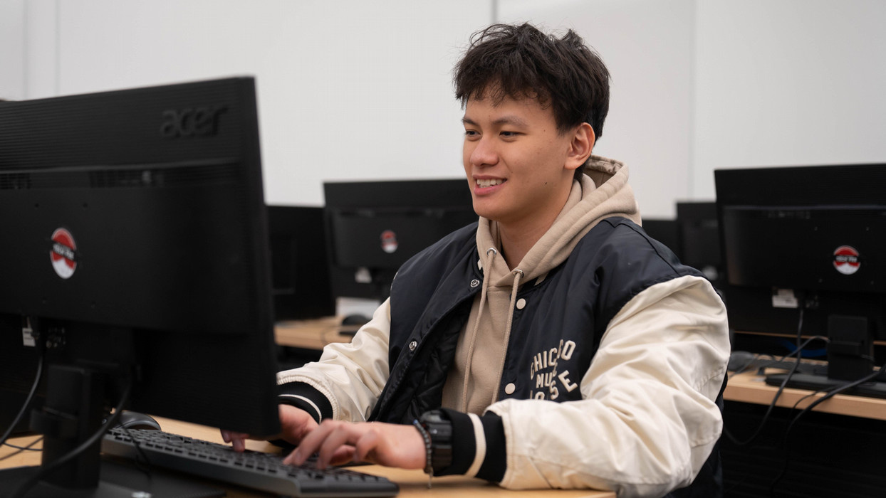 A student smiles from ear to ear within the career technical education program at Central Washington University.