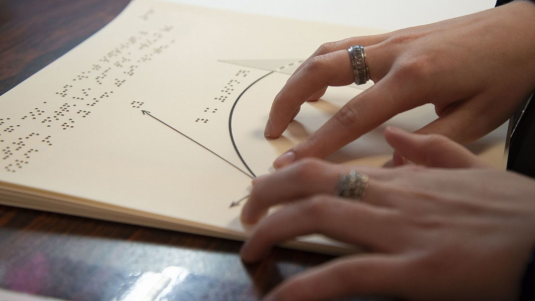 A student studies braille at Central Washington University.