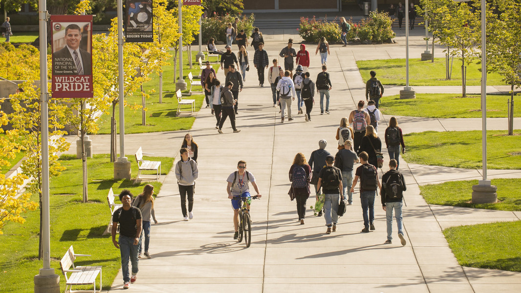 Multiple students at Central Washington University walk to their classes.