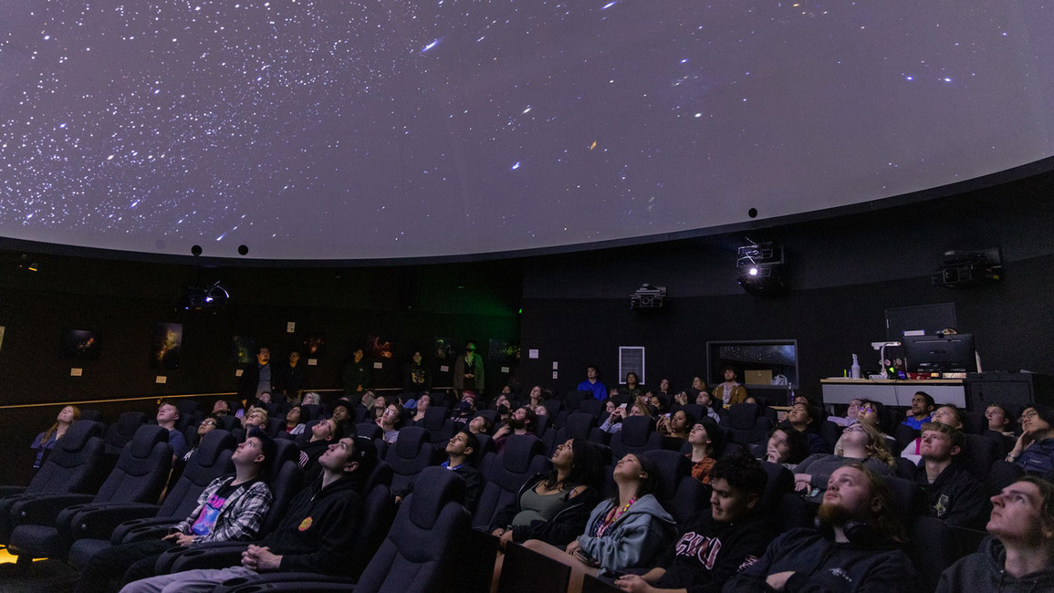 Students within the physics program at Central Washington University gaze upon the stars.