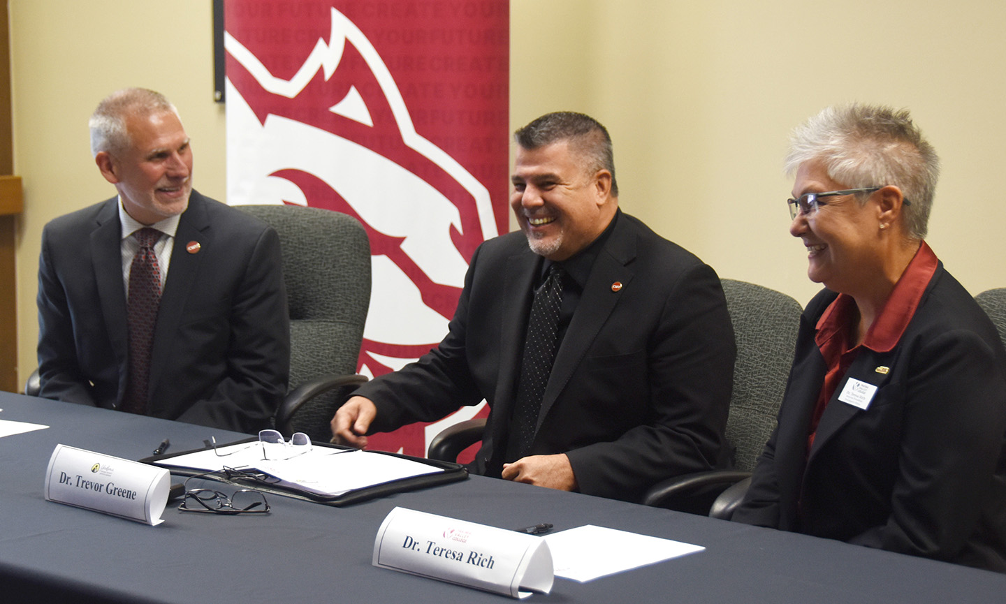 CWU President Jim Wohlpart, YSD Superintendent Trevor Greene and YVC Interim President Teresa Rich share a laugh