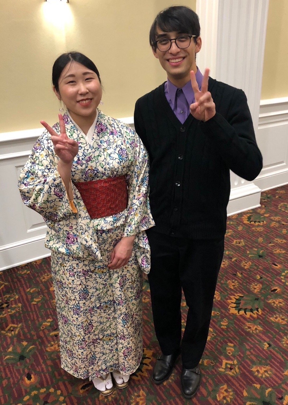 AJ Ingberman and a Japanese woman showing peace signs