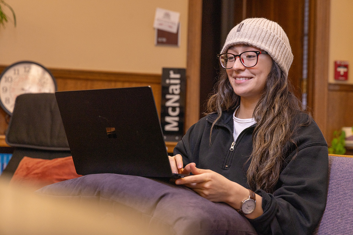 McNair Scholar Alyssa Castilla works on her computer in the McNair Room in Hebeler Hall.