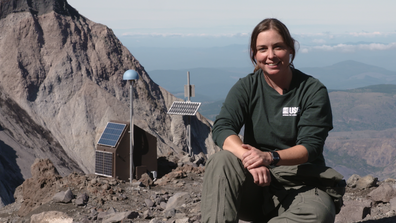 Angie Diefenbach sits atop Mount St. Helens