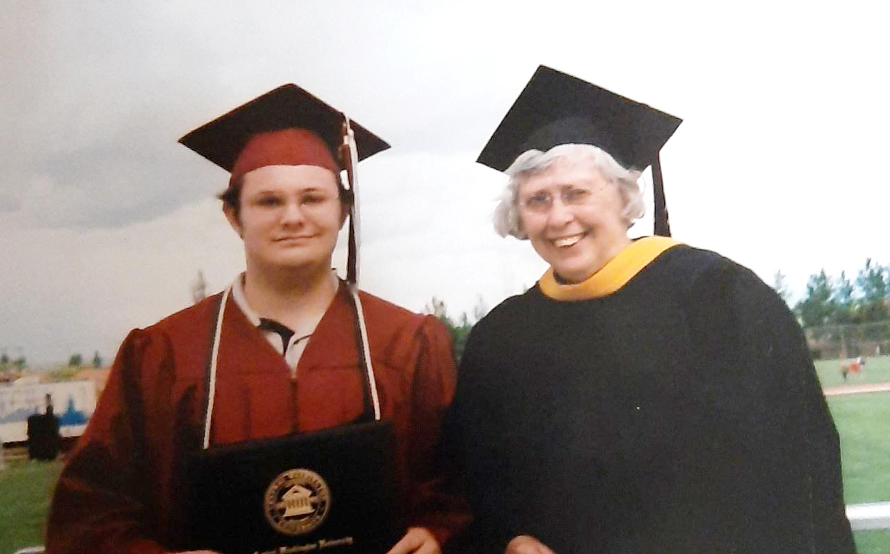 Anthony Smith celebrates his 2006 CWU graduation with Professor Sharon Rosell.