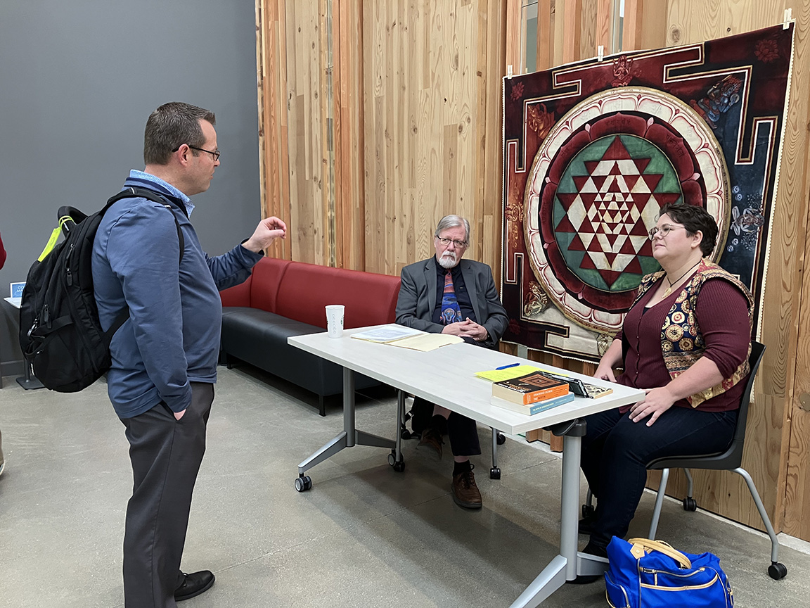 CAH Dean Chris Redfearn talks to an artist