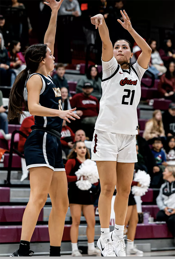 Asher Cai takes a shot over an opponent