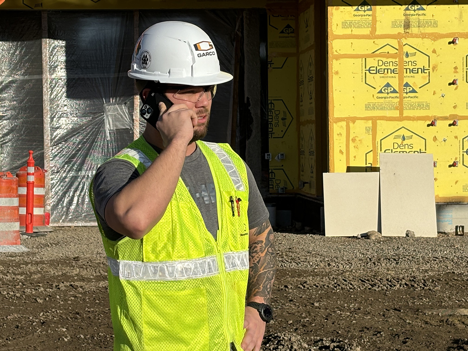 Ben Terrell talks on the phone outside the NAC site
