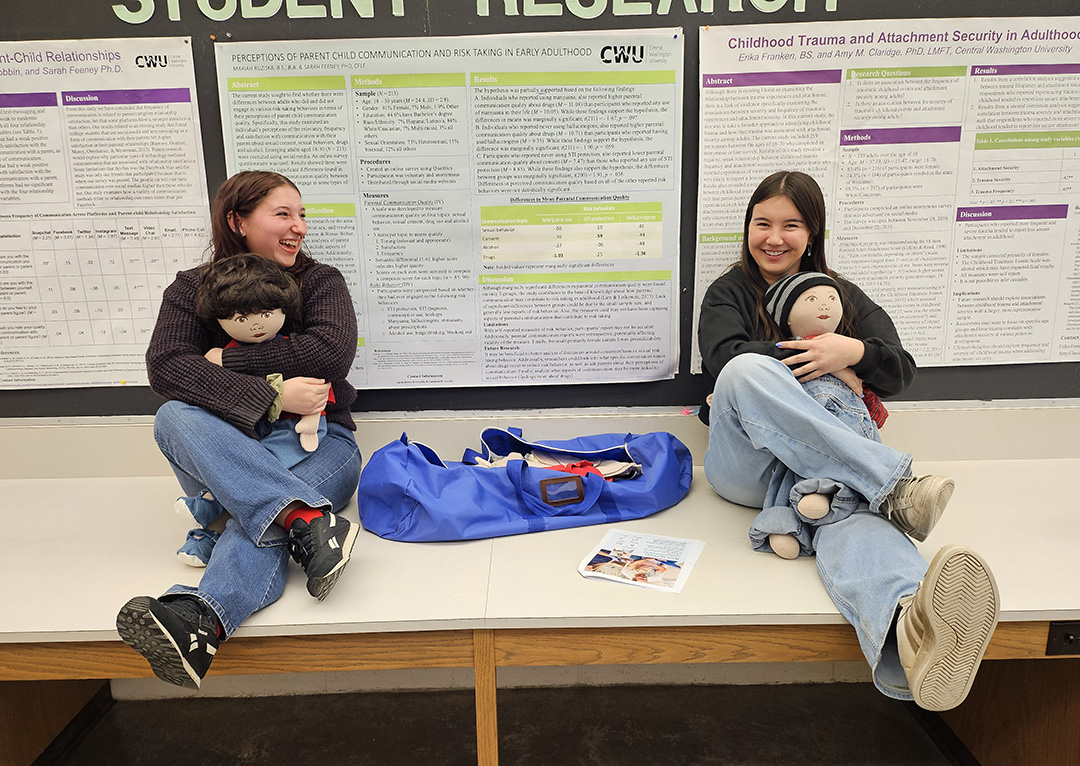 CWU Child Life students hold baby dolls during one of their class field trips