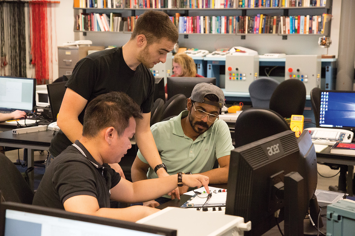 CMGT students work on a project in the classroom