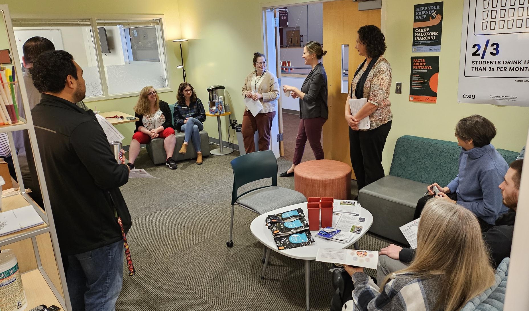 People gather inside the CWU Office of Health Promotion