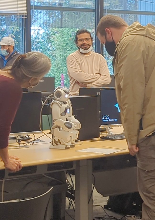CWU-Des Moines students observe Robbi the Robot earlier this fall
