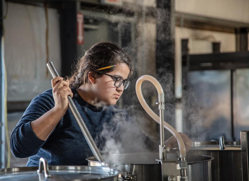 CWU Craft Brewing student Karina Morel Ugalde practices her brewing technique.