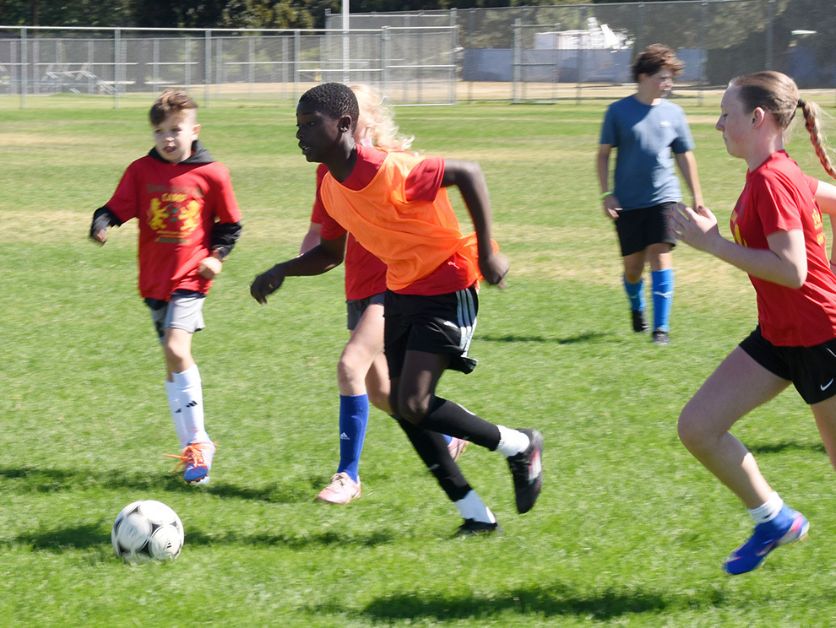 Bawa Soccer Camp participants play a game of soccer.