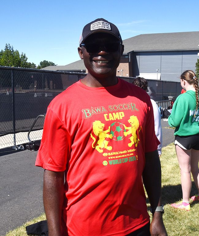 Blaise Dondji shows off the team shirt.