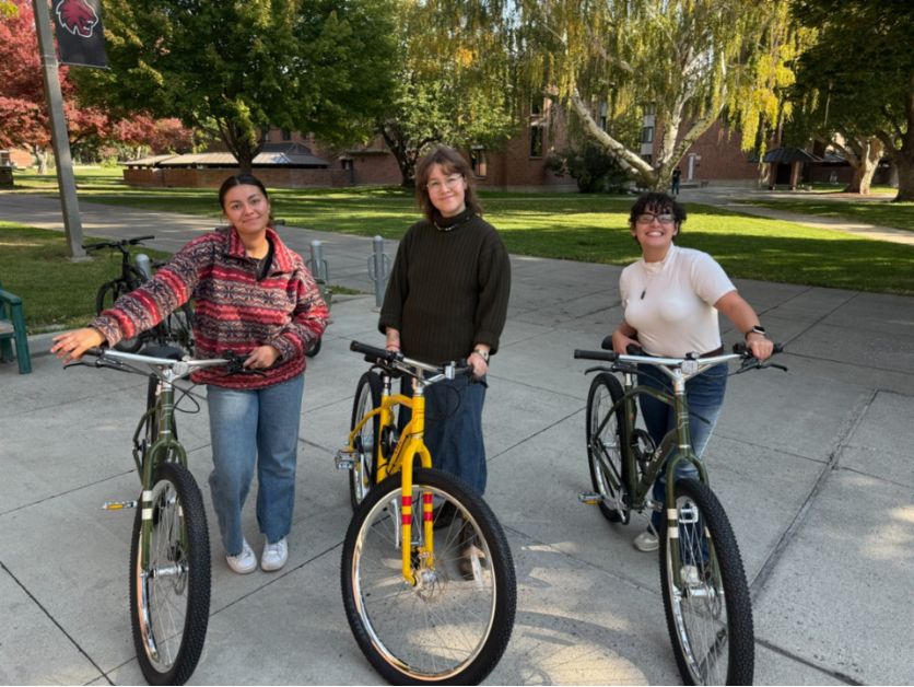 Photo of the Student Sustainability Coordinators with the Bike Share bikes on a sunny day