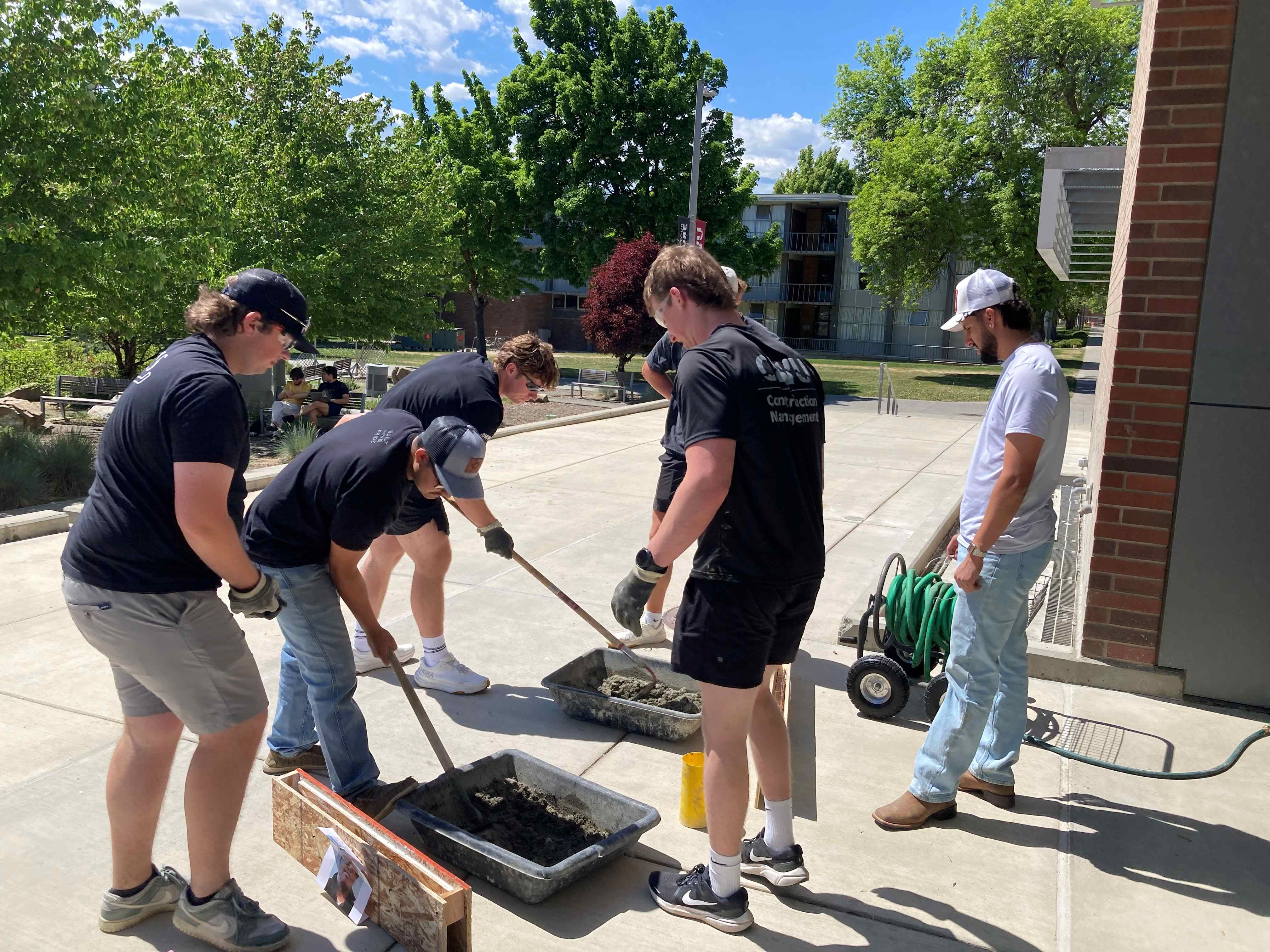 Students practice running a slump test.
