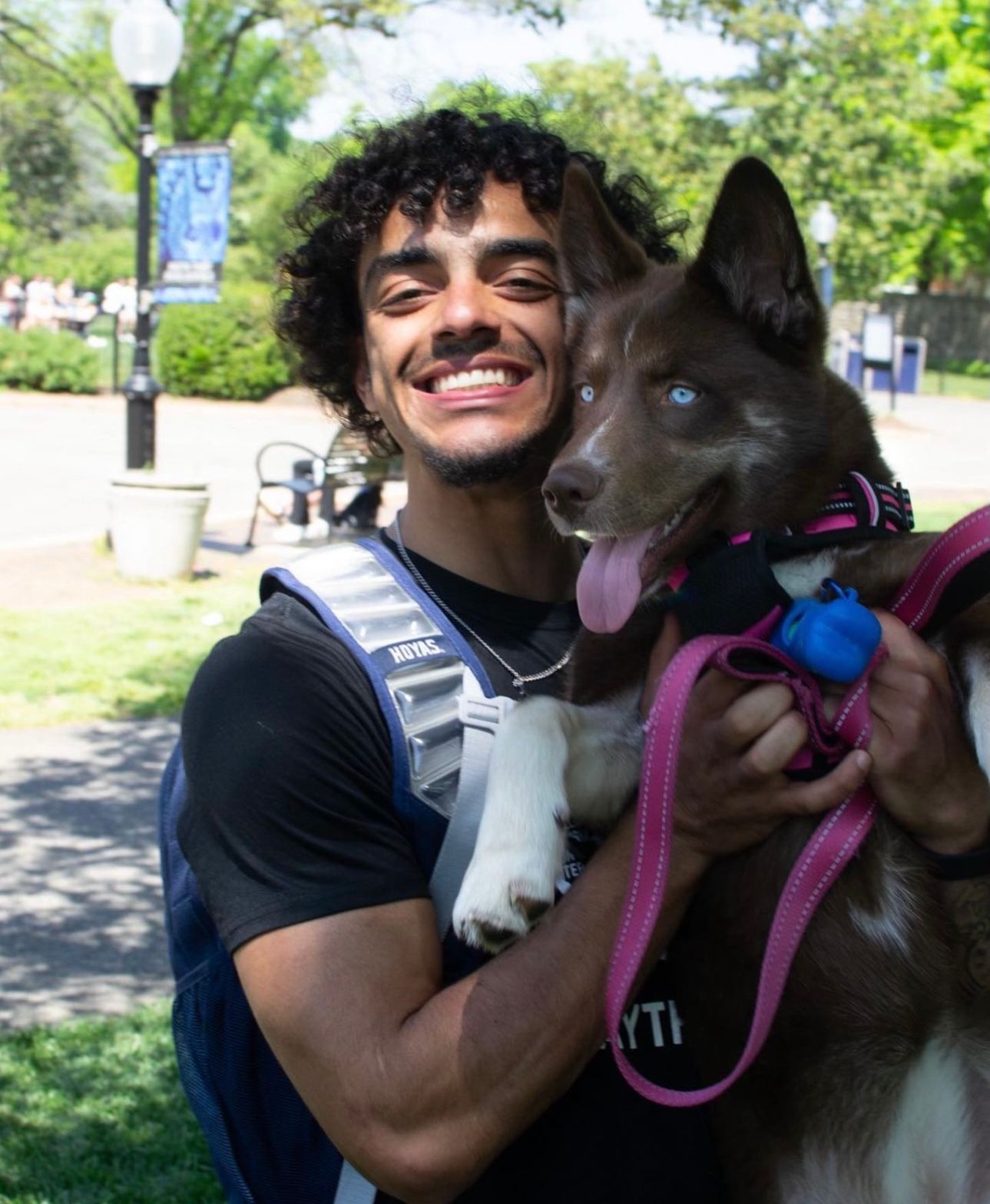 Portrait of Dontae Owens, and his dog