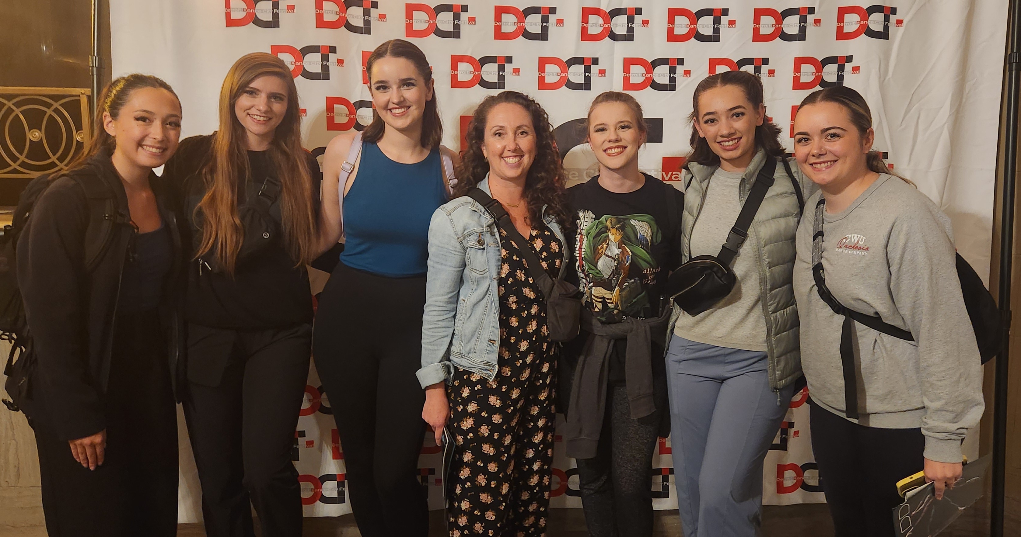 Students posing with dance program director