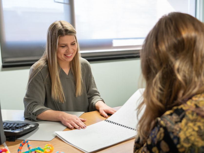 Photo of Kendall Smart working with a student at the Disability Services office