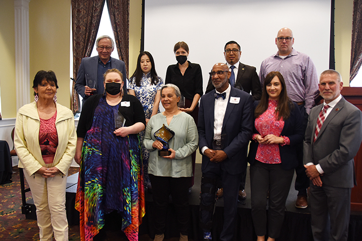 The 2022 CWU Diversity Awards winners joined President Wohlpart for a group photo last May.