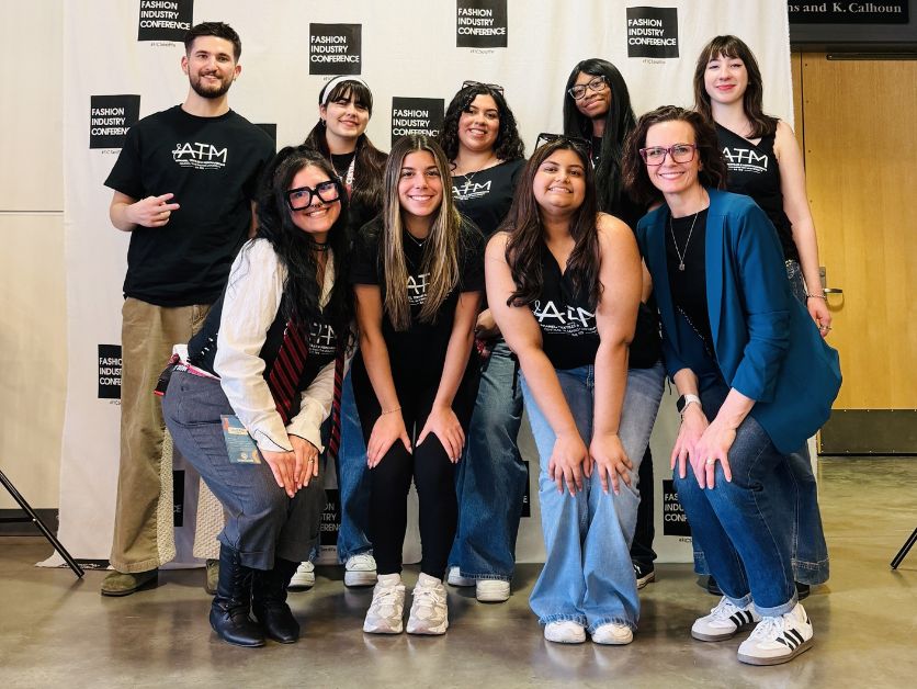 The eight Fashion industry Conference interns pose.