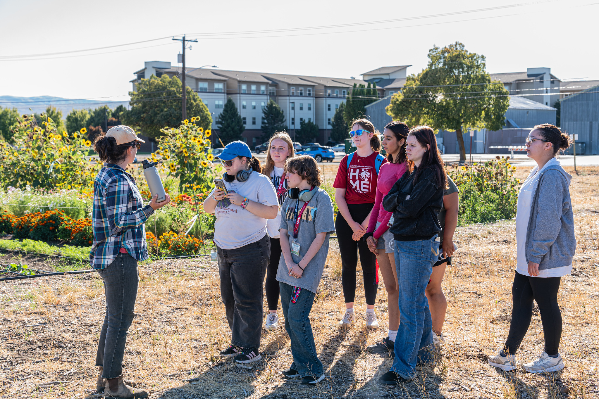 Photo of Jump Start students getting a tour of the Wildcat Neighborhood Farm.