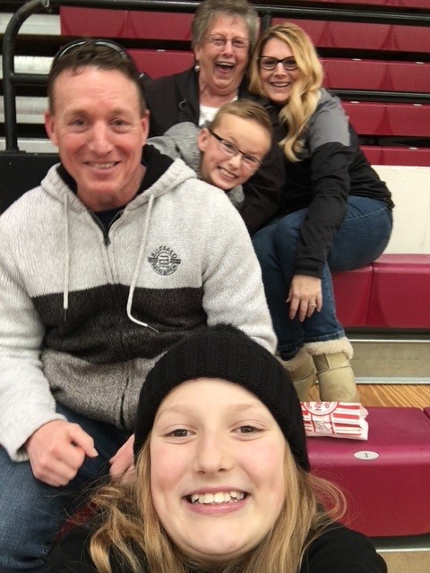 Kim Dawson at a basketball game with her family