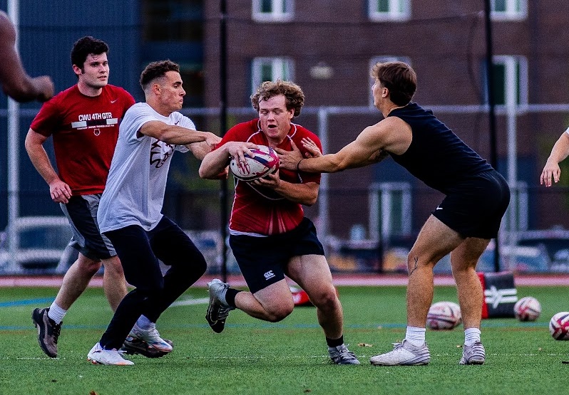 CWU men's rugby club players compete at a recent practice on campus.