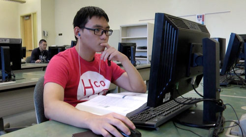 Student using a computer in computer lab.