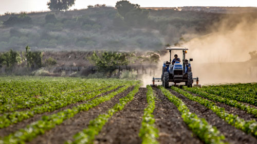 Tractor plowing a field. Represents CWU's Food and Ag Business Minor / Certificate program.