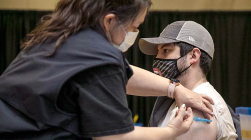 CWU student receiving COVID-19 vaccine.