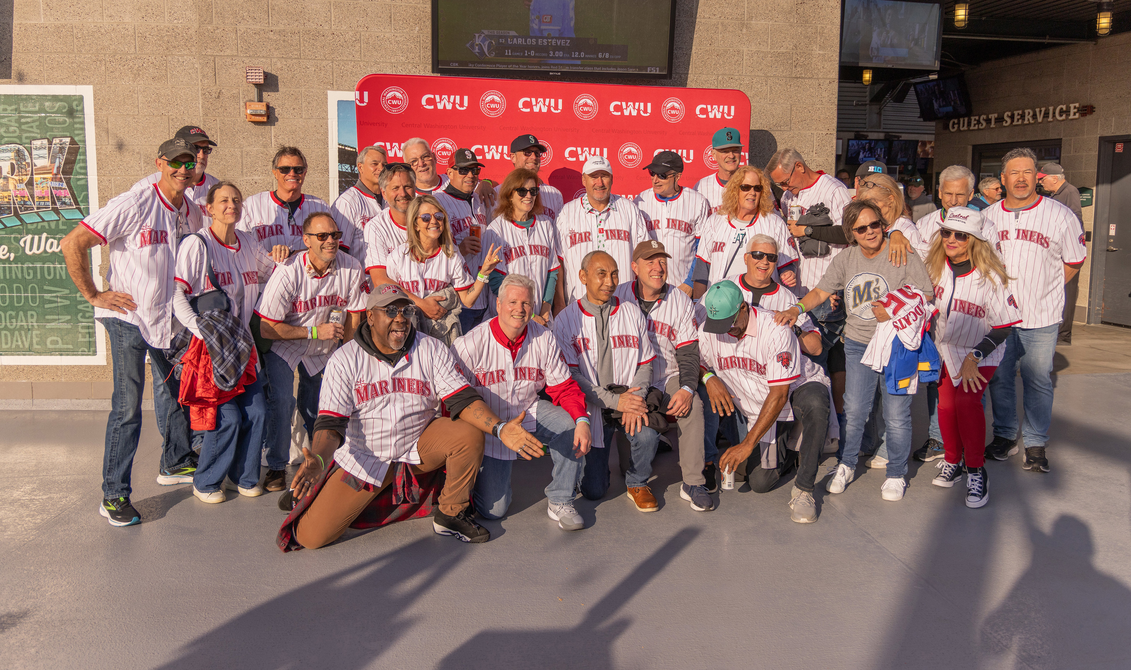 A group of CWU alumni gathers at T-Mobile Field this spring