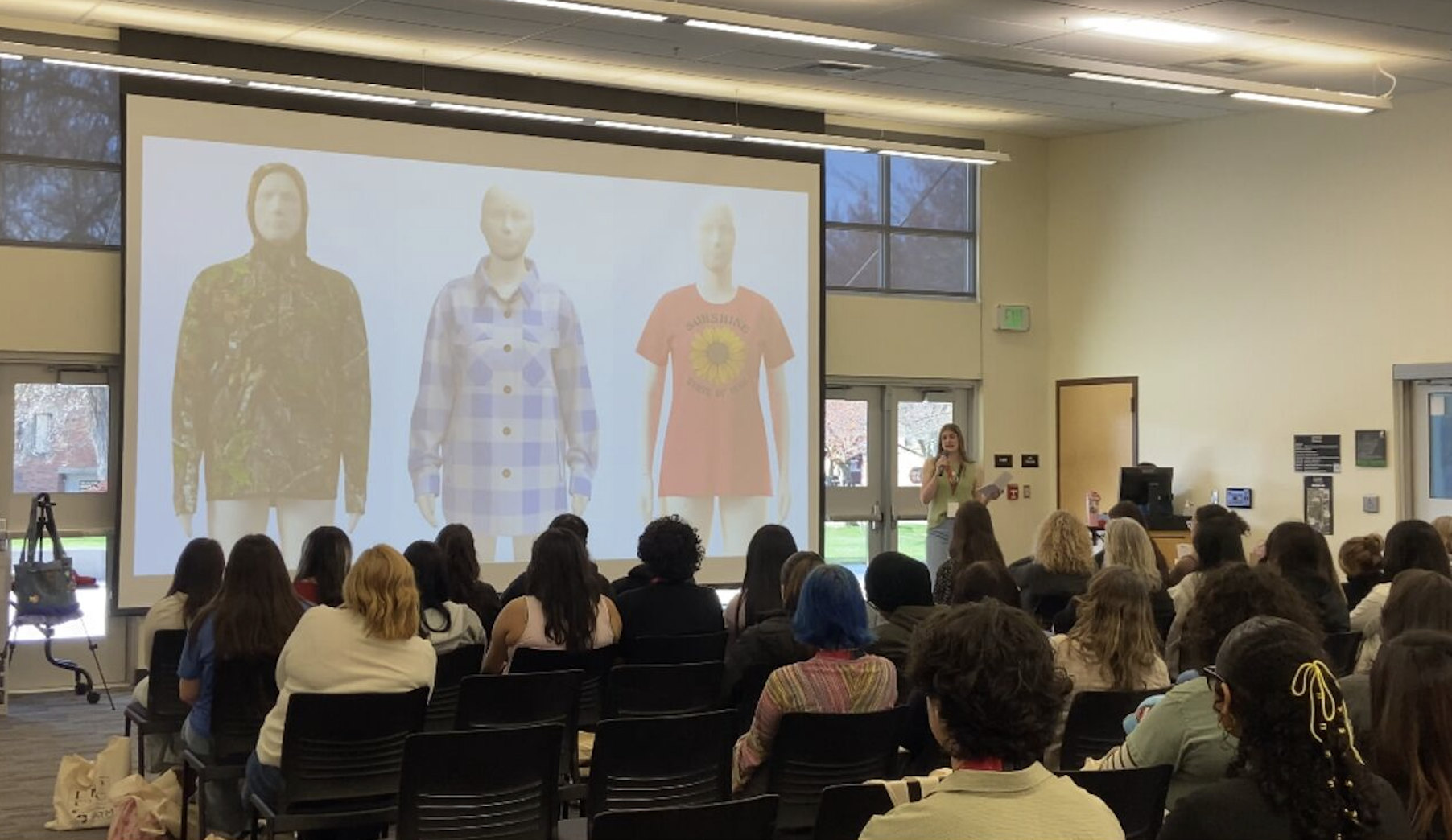 Guests watch the presentation at the Fashion Industry Conference