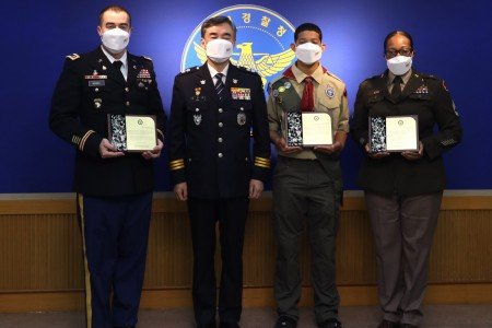 Gabriel Bowns, left, and two others were honored by Korean officials for their life-saving actions.