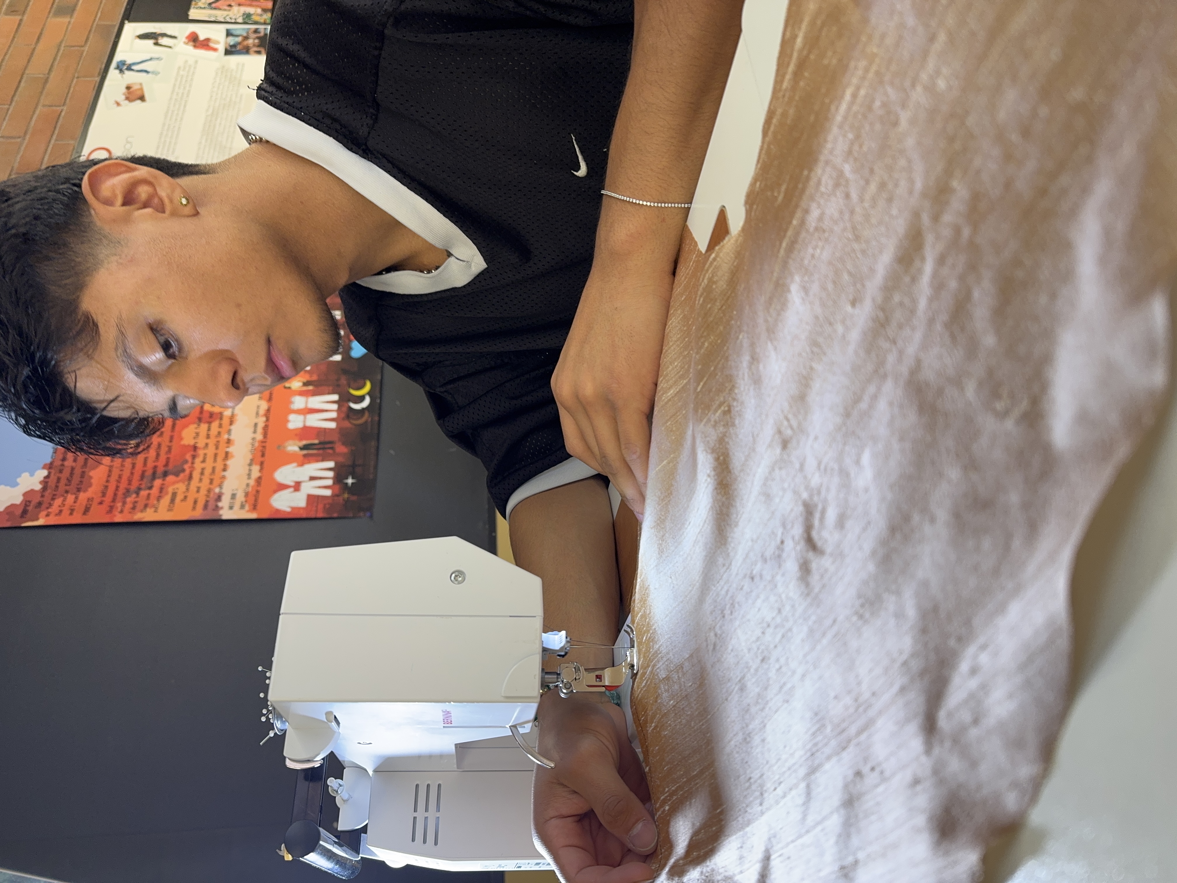 Gerardo Castillo-Regalado working on his clothes.