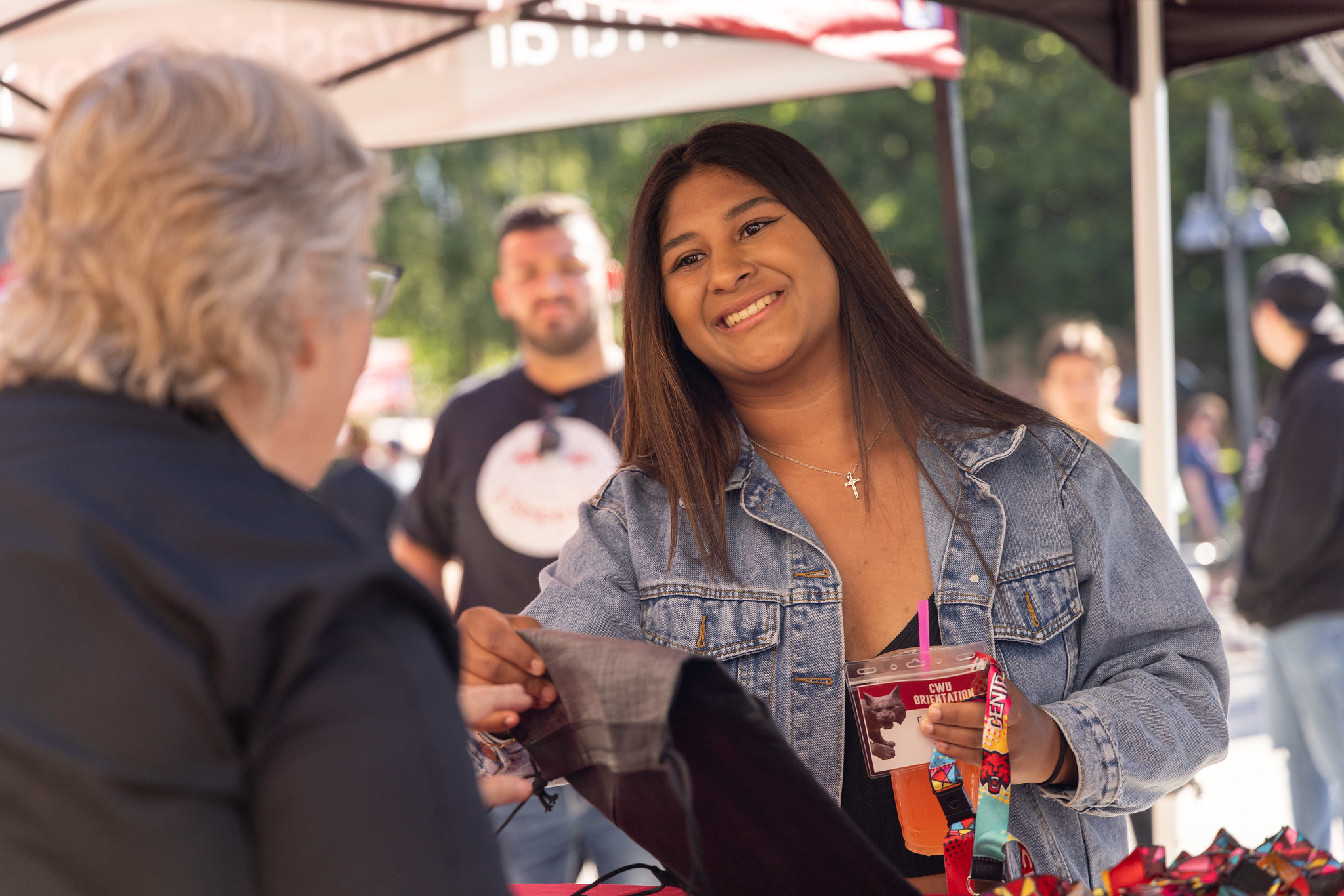 A young woman is greeted at Admitted Students Day in 2023