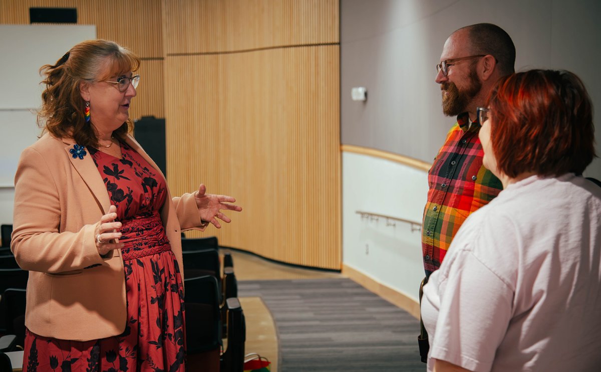 CWU Provost Michelle DenBeste talks to two event participants
