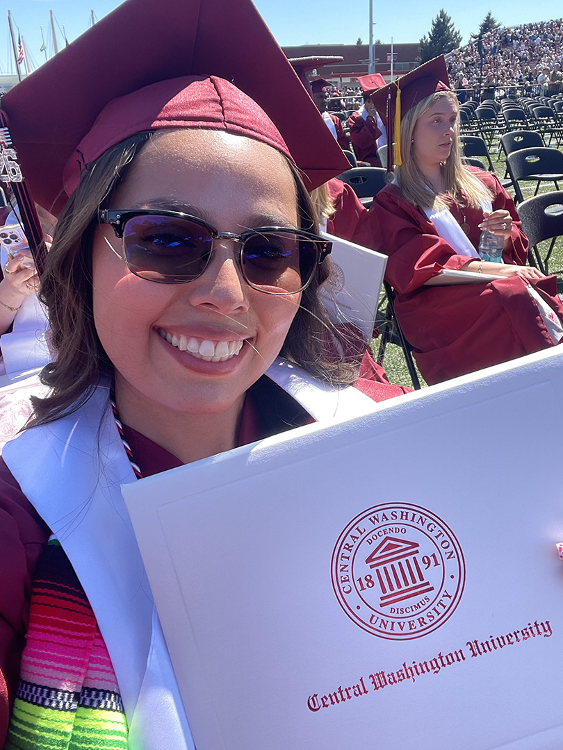 Headshot of Janae Martinez in a graduation cap