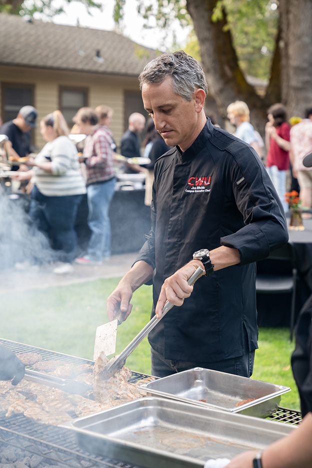 Campus Executive Chef Joe Ritchie cooks up a gourmet meal for guests at University House.