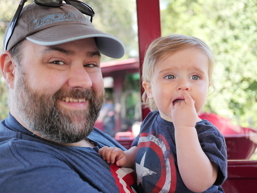 Joe Wilbur holds his son