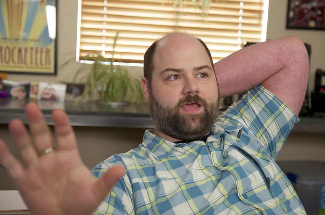 Joe Wilbur sitting at his desk