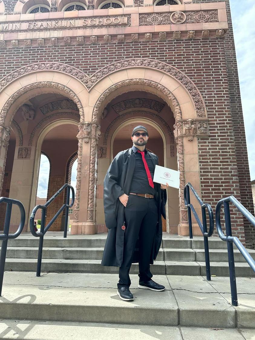 Juan Serrano on the steps of his former middle school in Yakima