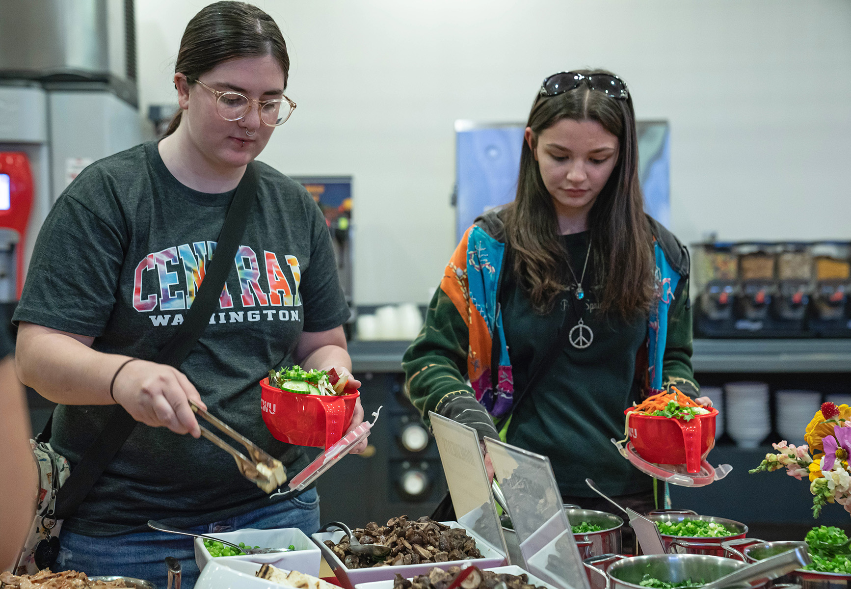 Students fill their bowls at the Bowls of Abundance event