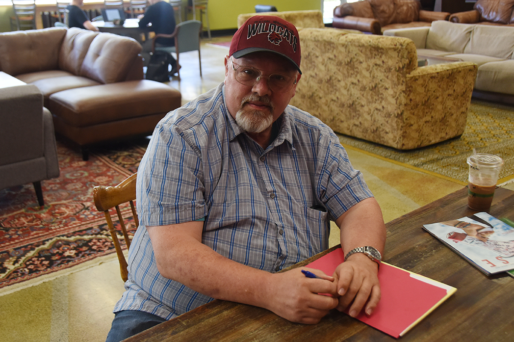 Keith Jones sits at a table in The Bistro