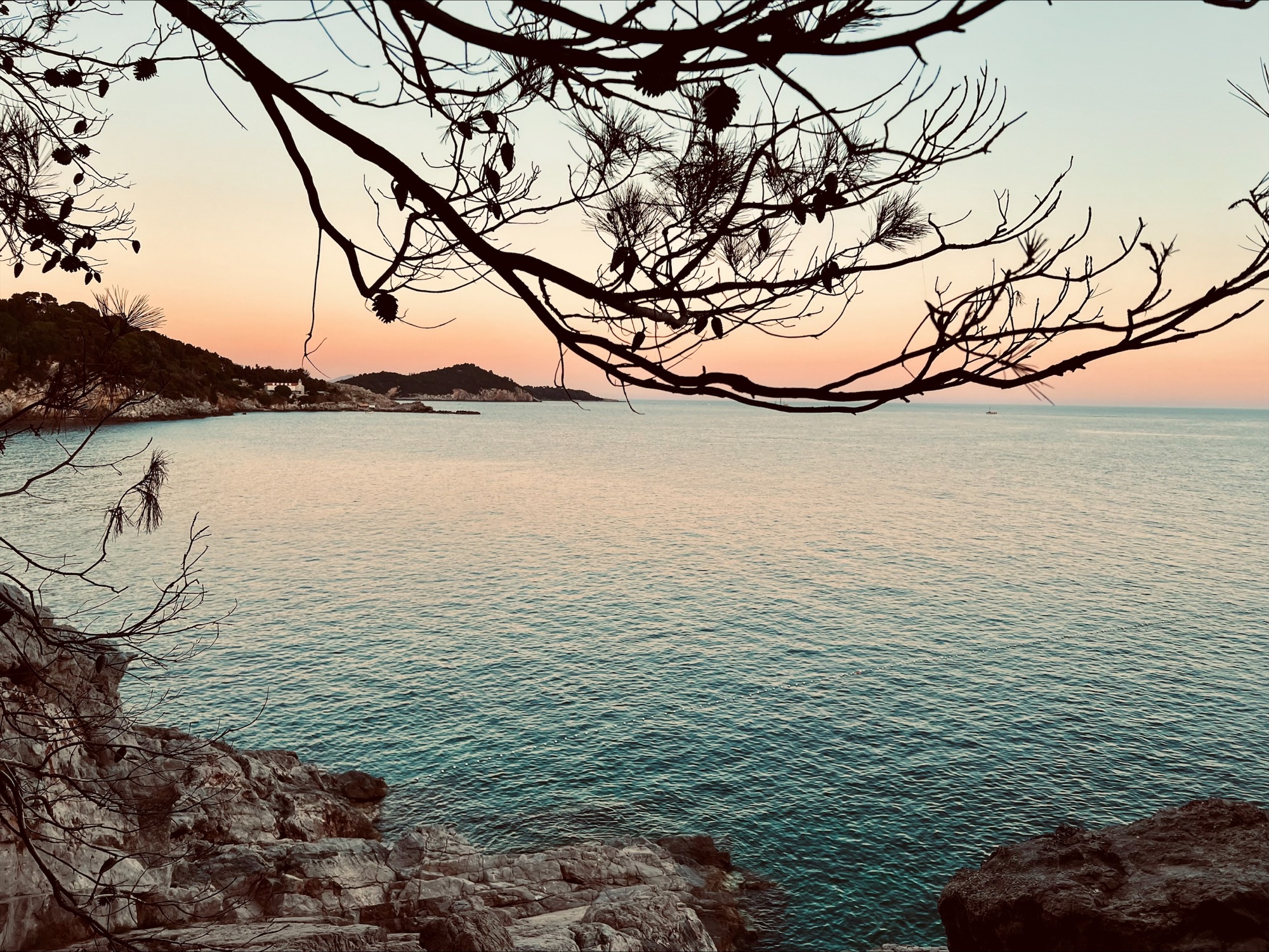 A large body of water in Croatia at sunset
